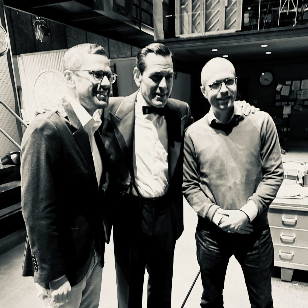 New York Times Publisher A.G. Sulzberger (right), producer Alex Levy (left) flanking Mr. Clooney.