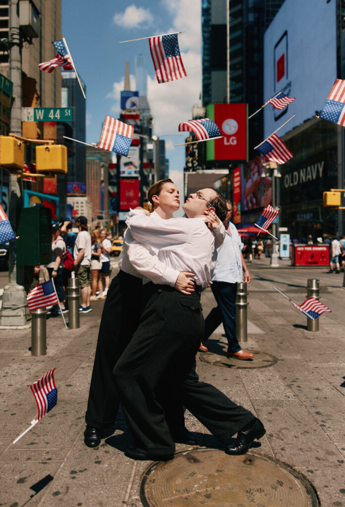 “OPERATION MINCEMEAT” CELEBRATES “V-J DAY” WITH TIMES SQUARE KISS